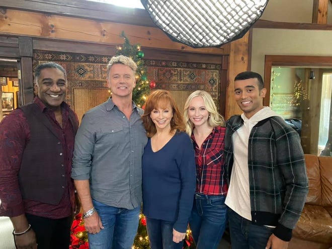 Justin David, far right, will star in the Lifetime movie “Christmas In Tune” with fellow co-stars, from left, Norm Lewis, John Schneider, Reba McEntire and Candice King.