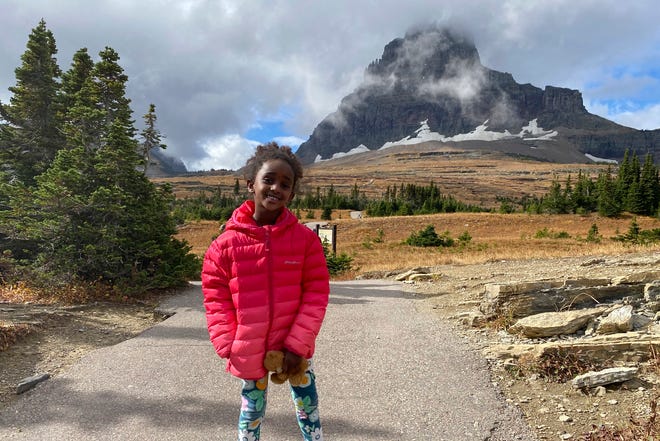 Naomi Pascal, holding her teddy bear, is pictured on a hike to Hidden Lake in Glacier National Park, Mont., in October 2020.