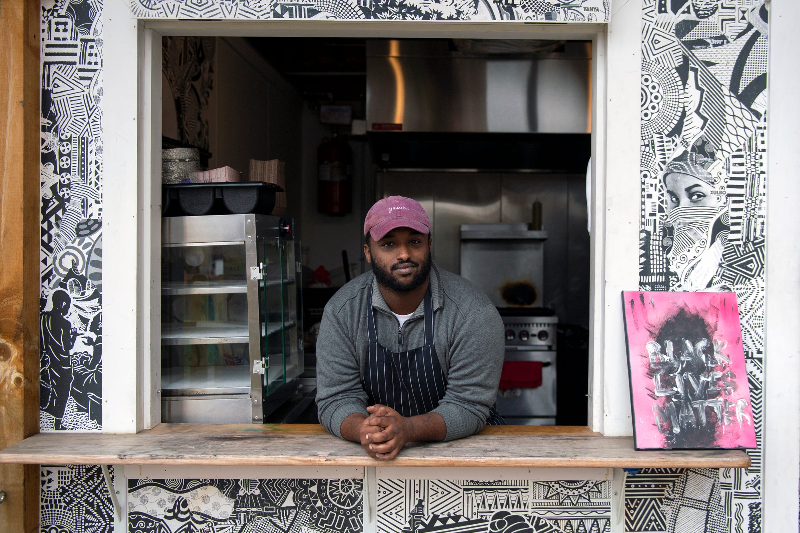 Bridge founder Mustafa Nuur runs the Xulbo food stand in Lancaster.