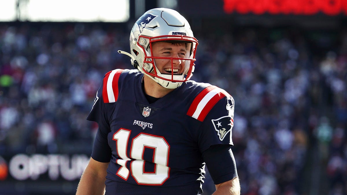 New England Patriots quarterback Mac Jones smiles as he celebrates a touchdown against the New York Jets during an NFL football game at Gillette Stadium, Sunday, Oct. 24, 2021 in Foxborough, Mass.