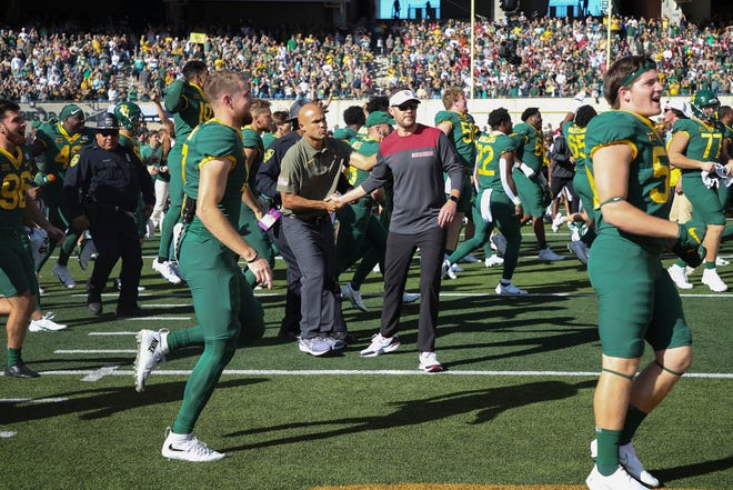 Baylor coach Dave Aranda and OU's Lincoln Riley shake hands after this year's game.
