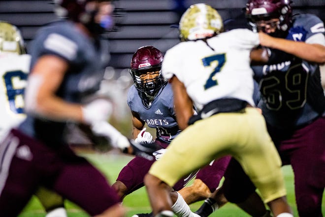 Benedictine's Justin Thomas looks for running room against the Thomas County Central defense during the GHSA Class 4A playoffs last Friday night at Memorial Stadium.
