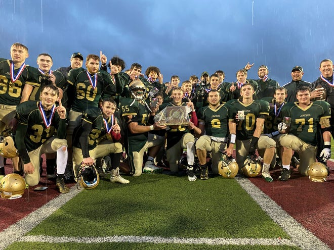 Windsor poses with the Division III championship trophy on Saturday at Rutland High School.