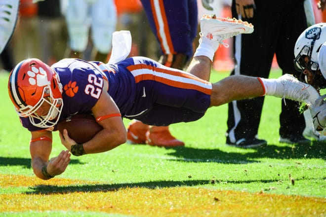 Clemson wide receiver Will Swinney (22) scores a touchdown during the first quarter of their game against UConn at Memorial Stadium Saturday, Nov. 13, 2021.