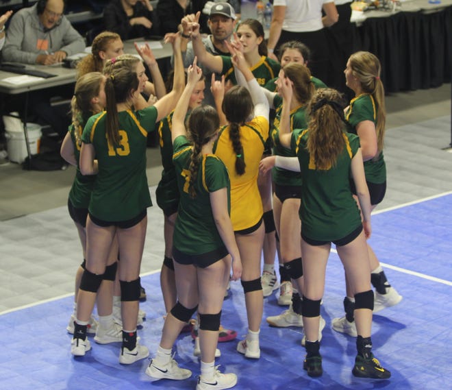 The C.M. Russell Lady Rustlers celebrate their 30th consecutive win as they beat Billings West in straight sets in the undefeated semifinals of the Class AA State volleyball Tournament Saturday in Bozeman.