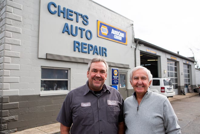 Steve Brown (left), owner of Chet's Auto Repair, stands with his father, Chet Brown, in front of Chet's Auto Repair in Pataskala, Ohio on November 11, 2021.