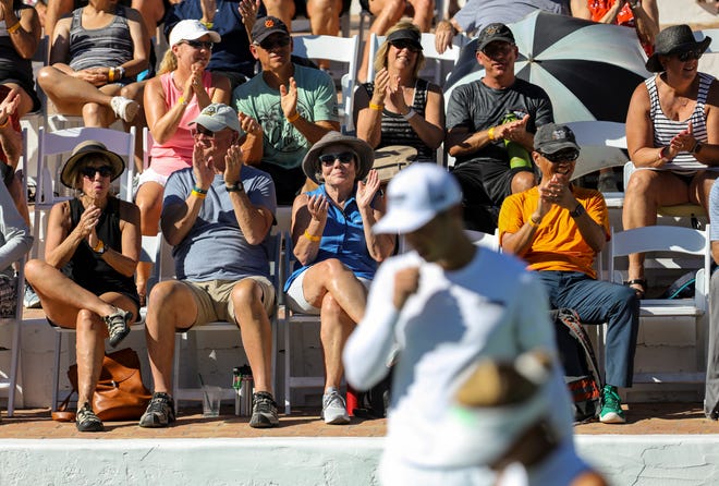 Spectators applaud mixed doubles players during the Pro Pickleball Association Masters tournament at the La Quinta Resort and Club, Friday, Nov. 12, 2021, in La Quinta, Calif. 