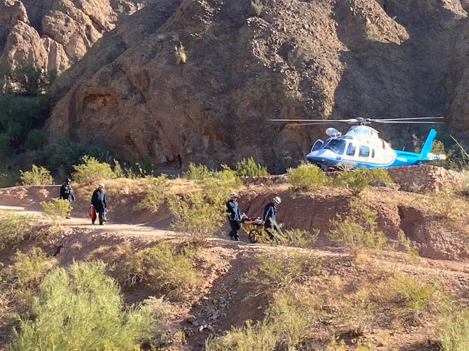 An injured hiker is flown off Camelback Mountain's hiking trail after suffering from back spasms on Nov. 12, 2021