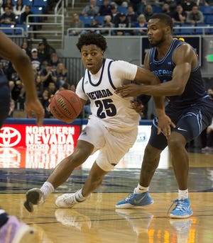 Nevada guard Grant Sherfield looks for room against the San Diego defense on Friday.