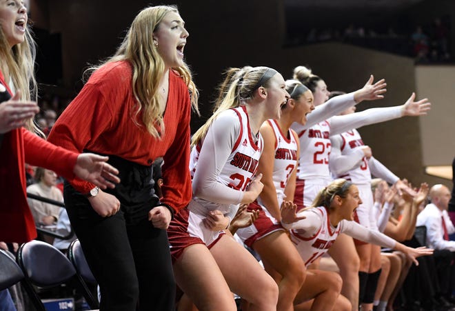 The South Dakota women's basketball team cheers after a basket in the game against South Carolina on Friday, November 12, 2021, at the Sanford Pentagon in Sioux Falls.