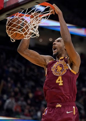 Cleveland Cavaliers' Evan Mobley (4) dunks the ball against the Boston Celtics in the second half of an NBA basketball game, Saturday, Nov. 13, 2021, in Cleveland. The Cavaliers won 91-89. (AP Photo/Tony Dejak)