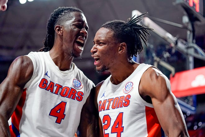 Florida forward Anthony Duruji (4) and guard Phlandrous Fleming Jr. (24) celebrate a big play during the final minutes of the second half Sunday against Florida State.