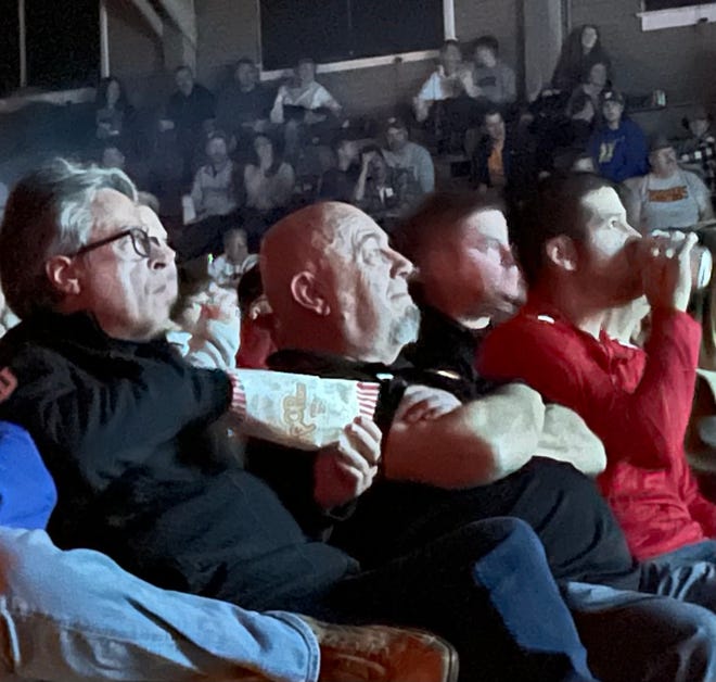 "Hoosiers" writer Angelo Pizzo (left) watches the never-before-seen version of his movie at the Hoosier Gym in Knightstown Saturday, Nov. 13, 2021.