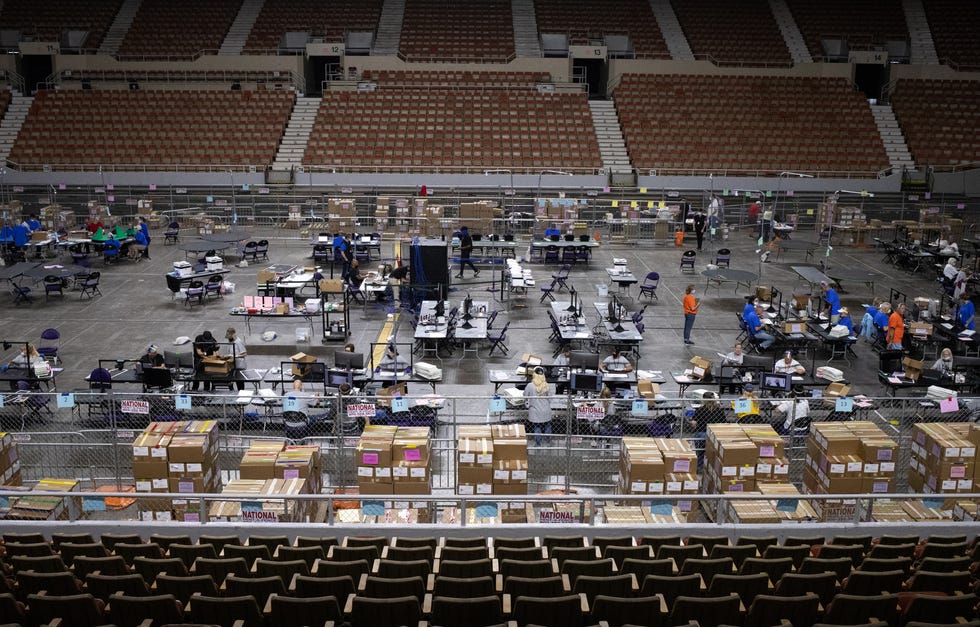 Maricopa County ballots from the 2020 general election are examined and recounted by contractors hired by the Arizona senate, June 23, 2021, at the Veterans Memorial Coliseum, Phoenix, Arizona.