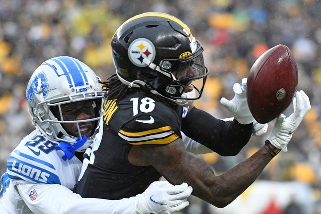 Pittsburgh Steelers wide receiver Diontae Johnson (18) can't hold onto a pass from quarterback Mason Rudolph with Detroit Lions cornerback Jerry Jacobs (39) defending during the second half of an NFL football game in Pittsburgh, Sunday, Nov. 14, 2021. (AP Photo/Don Wright)