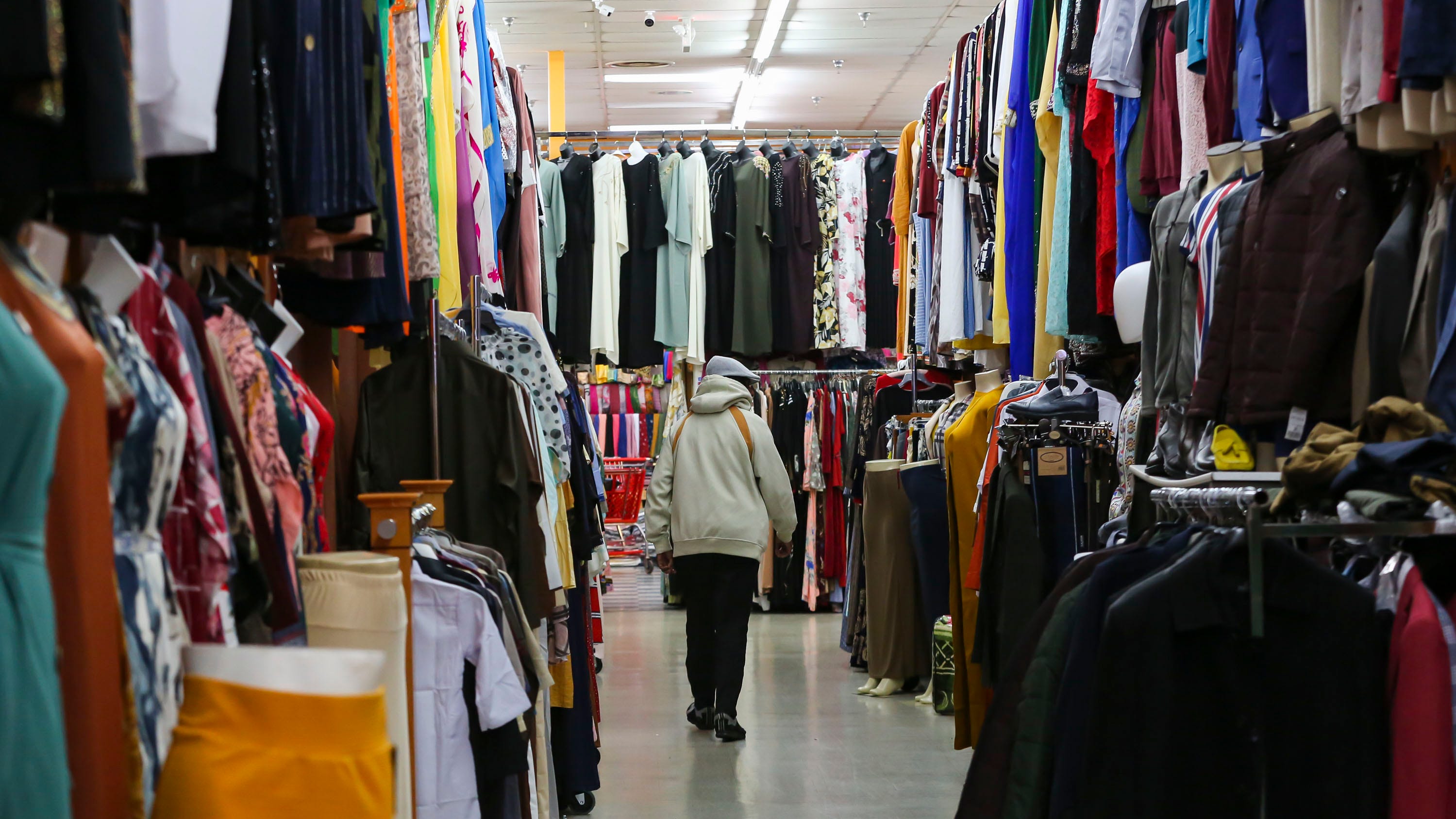 A man walks down an aisle inside the Global Mall on Morse Road. The 30 businesses that make up the mall offer a range of goods and services and are mostly owned by Somalis.