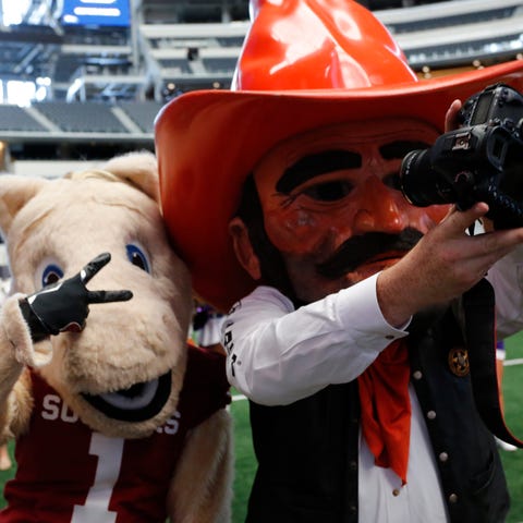 OU and OSU mascots Boomer, left, and Pistol Pete w