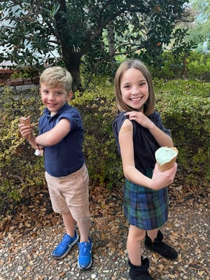 John and Clare Wilson with their celebratory ice cream after receiving their first dose of the COVID-19 vaccine last week.