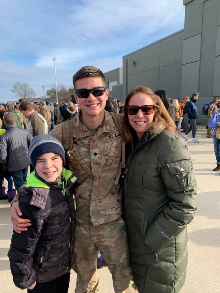 Evan Olson, center, with his mother, Juli Olson, and brother Isaiah Olson after Evan returned from Afghanistan in 2019.