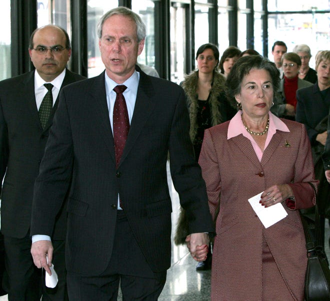 Robert Creamer, center, the husband of Rep. Jan Schakowsky, right, D-Ill., leaves federal court with his attorney Theodore Poulos, left, Wednesday, April 5, 2006, in Chicago. Creamer, who ran a public interest group in the 1990s, was sentenced to five months in federal prison for writing rubber checks and failing to pay withholding taxes.  Rep. Schakowsky has not been accused of any wrongdoing.