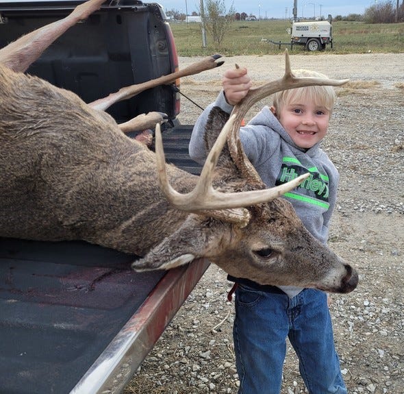 Seven-year-old Jackson Boyer, of Hillsboro, with his first deer harvest, which he took in Adair County.