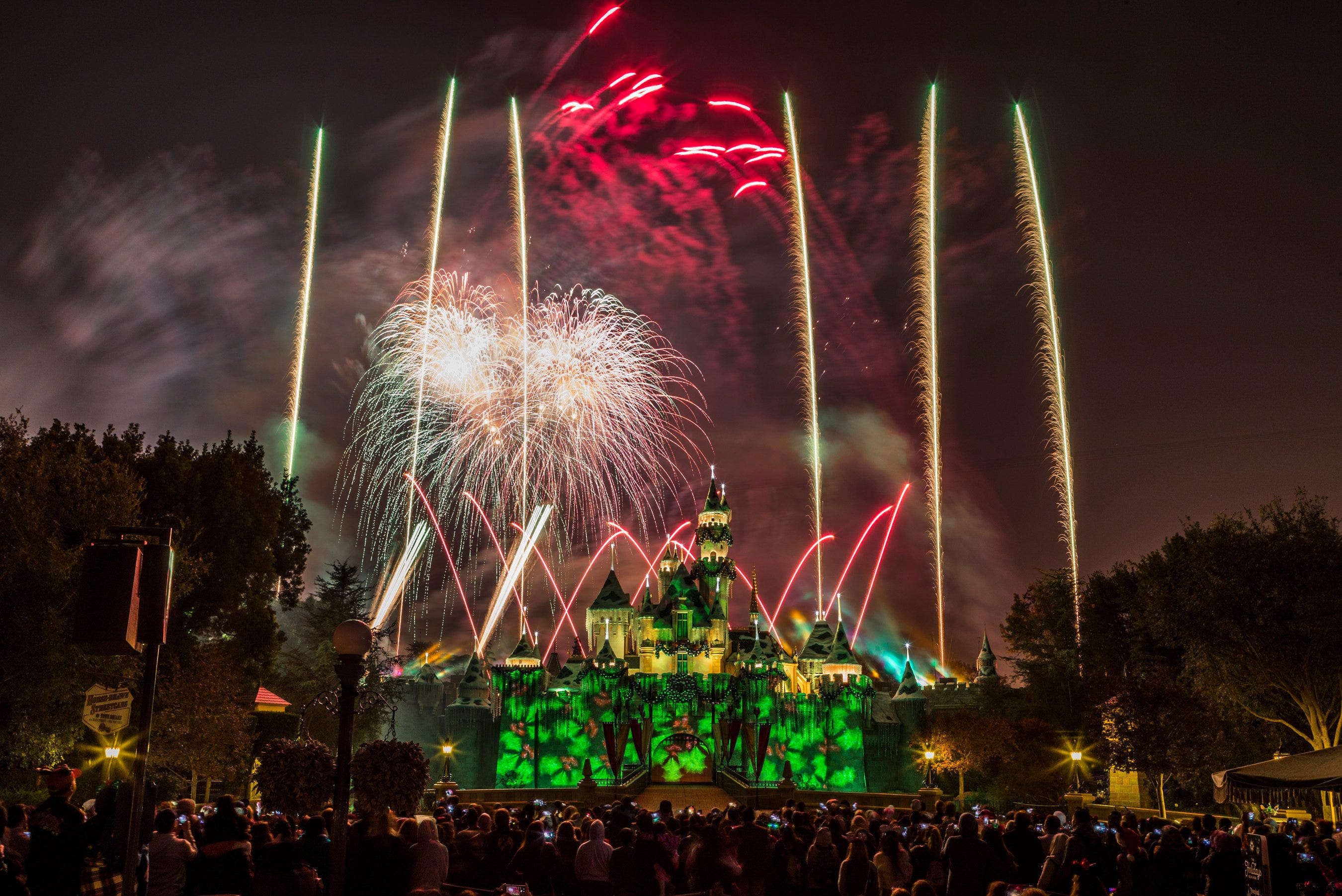 "Believe...in Holiday Magic" holiday fireworks are seen over Sleeping Beauty's Winter Castle at Disneyland Park.