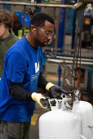 A Worthington Industries worker makes tanks used by the HVAC industry. The company is in a dispute with the Environmental Protection Agency, which wants to ban the tanks.