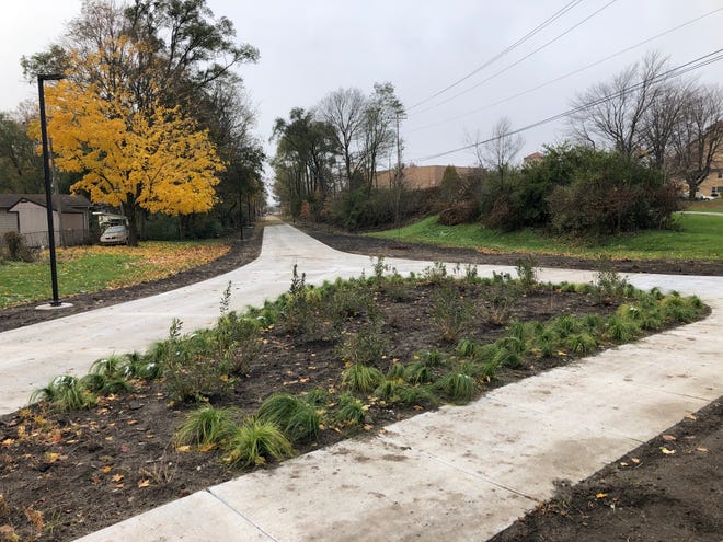 Plants and lights have gone in on South Bend's Coal Line Trail at Vassar Avenue. This is looking west on Tuesday as the trail, which hasn't been finished or opened yet, goes behind Holy Cross School.
