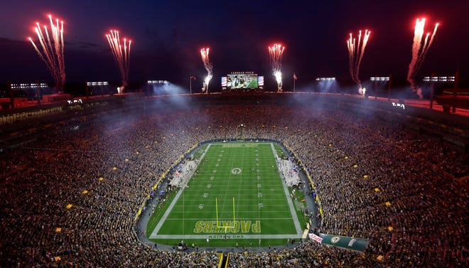 Fireworks go off during the national anthem over Lambeau Field before the start of the Green Bay Packers game against the Detroit Lions on Sept. 20, 2021, in Green Bay, Wis. This was the first regular season game with a full stadium of fans since the start of the coronavirus pandemic.
