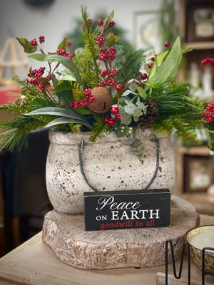 Containers can be filled with Christmas decorations, greenery or silk flowers for easy decorating. Halls Flower Shop, Nov. 15, 2021.