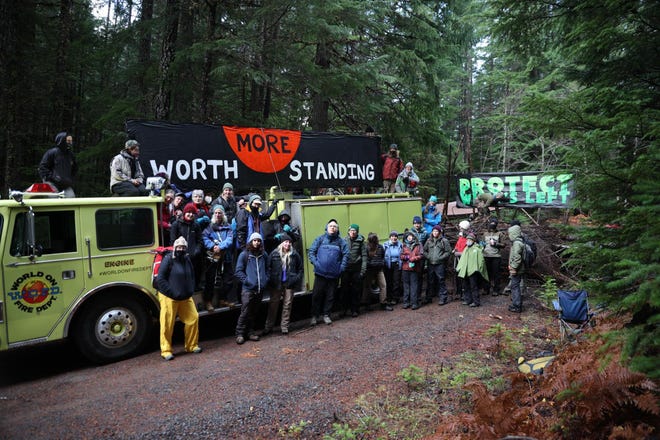 A group from Cascadia Forest Defenders is attempting to block logging near Detroit in forest burned by the Labor Day Fires.