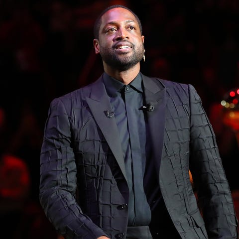 Heat former player Dwyane Wade reacts during his j