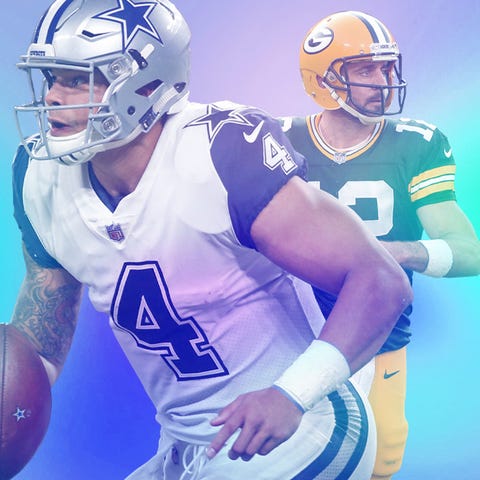 Cowboys QB Dak Prescott (4) and the Packers' Aaron