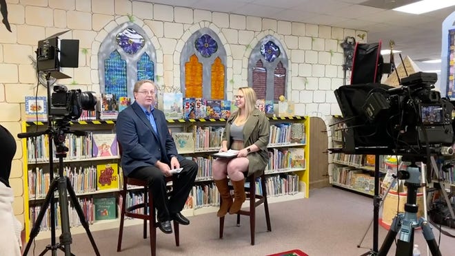 George Taylor, director of Lake County Library Services and a Disney historian, talks with Lake Report host and Daily Commercial Local News Editor Katie Sartoris during filming of a special Disney episode of the Lake Report.