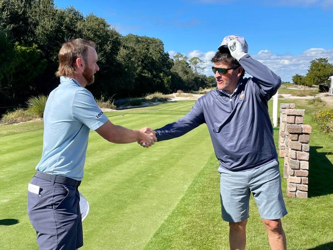 Tyler McCumber (left) shakes hands with John Haley of Atlantic Beach before the RSM Classic Pro-Am on Wednesday at the Sea Island Club Seaside Course.