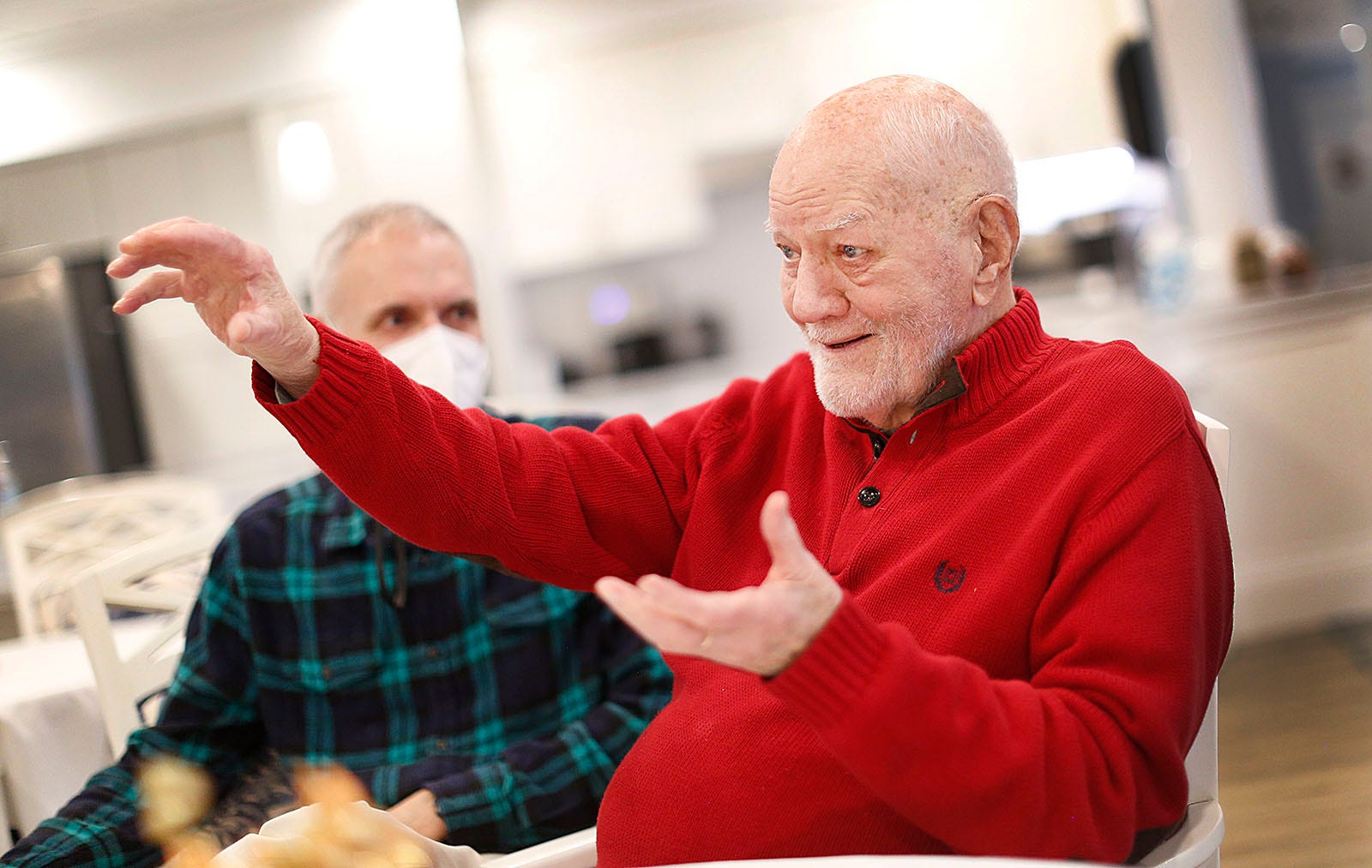 Ted Curtin, 95, right, talks with his son, Ted Curtin Jr. during a visit to The Duxbury House, a memory care residence that is part of the Village at Duxbury, on Wednesday, Nov. 17, 2021.