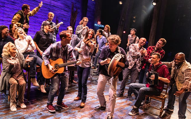 Cast members of "Come From Away" perform "Screech In" with the musical's band.