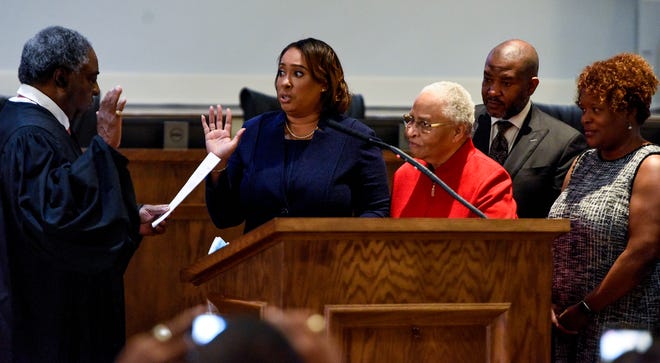Rep. Penni McClammy, with family friend Doris Crenshaw at her side, is sworn in as the new State Representative for House District 76 by retired Judge Charles Price at City Hall in Montgomery, Ala., on Wednesday November 17, 2021. 
