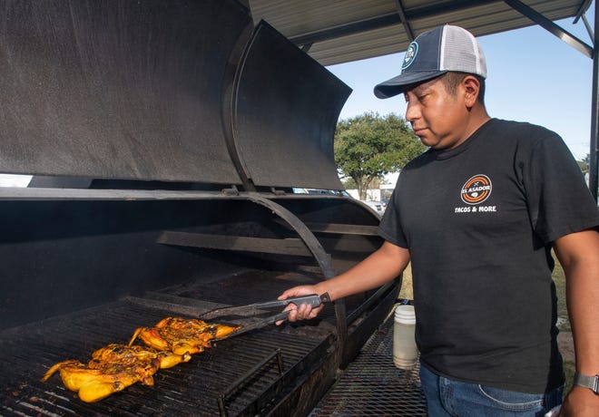 Luis Vega grills chicken at Taqueria El Asador's new second location at 406 Brent Lane in Pensacola on Wednesday.