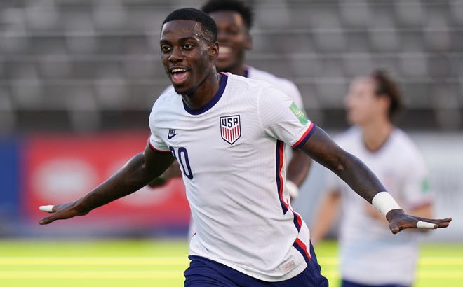 Tim Weah celebrates after scoring a goal against Jamaica.