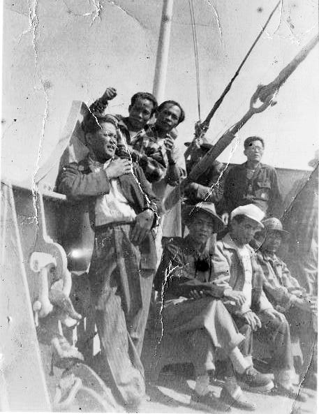 Filipino migrant workers travel aboard a ship in the 1950s.