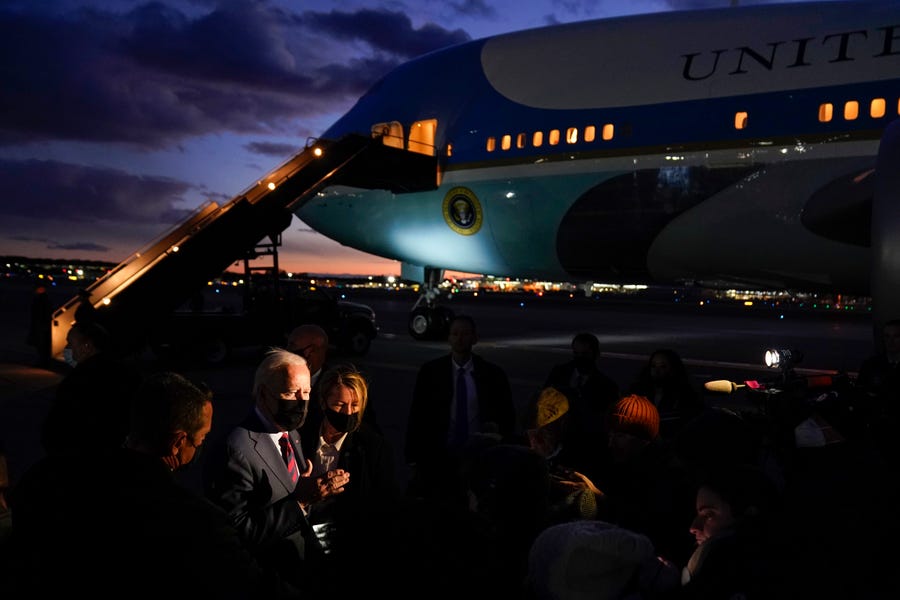 President Joe Biden speaks to reporters as he prepares to depart Manchester-Boston Regional Airport in Manchester, New Hampshire, on Tuesday, Nov. 16, 2021.
