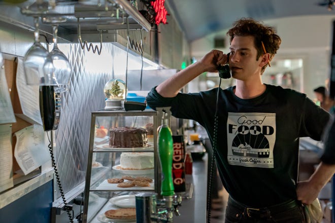 Andrew Garfield stars as a talented theatrical composer who works at a dinner party in New York City and hopes for a long break in "tic, tic ... BOOM!"