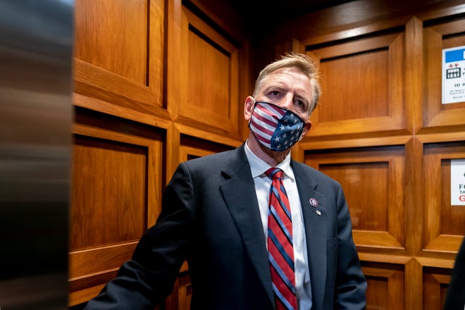 Republican Rep. Paul Gosar of Arizona takes an elevator on Capitol Hill on Wednesday, Nov. 17, 2021, as the House of Representatives prepares to vote on a resolution to formally rebuke him for tweeting an animated video that depicted him striking Rep. Alexandria Ocasio-Cortez, D-N.Y., with a sword.