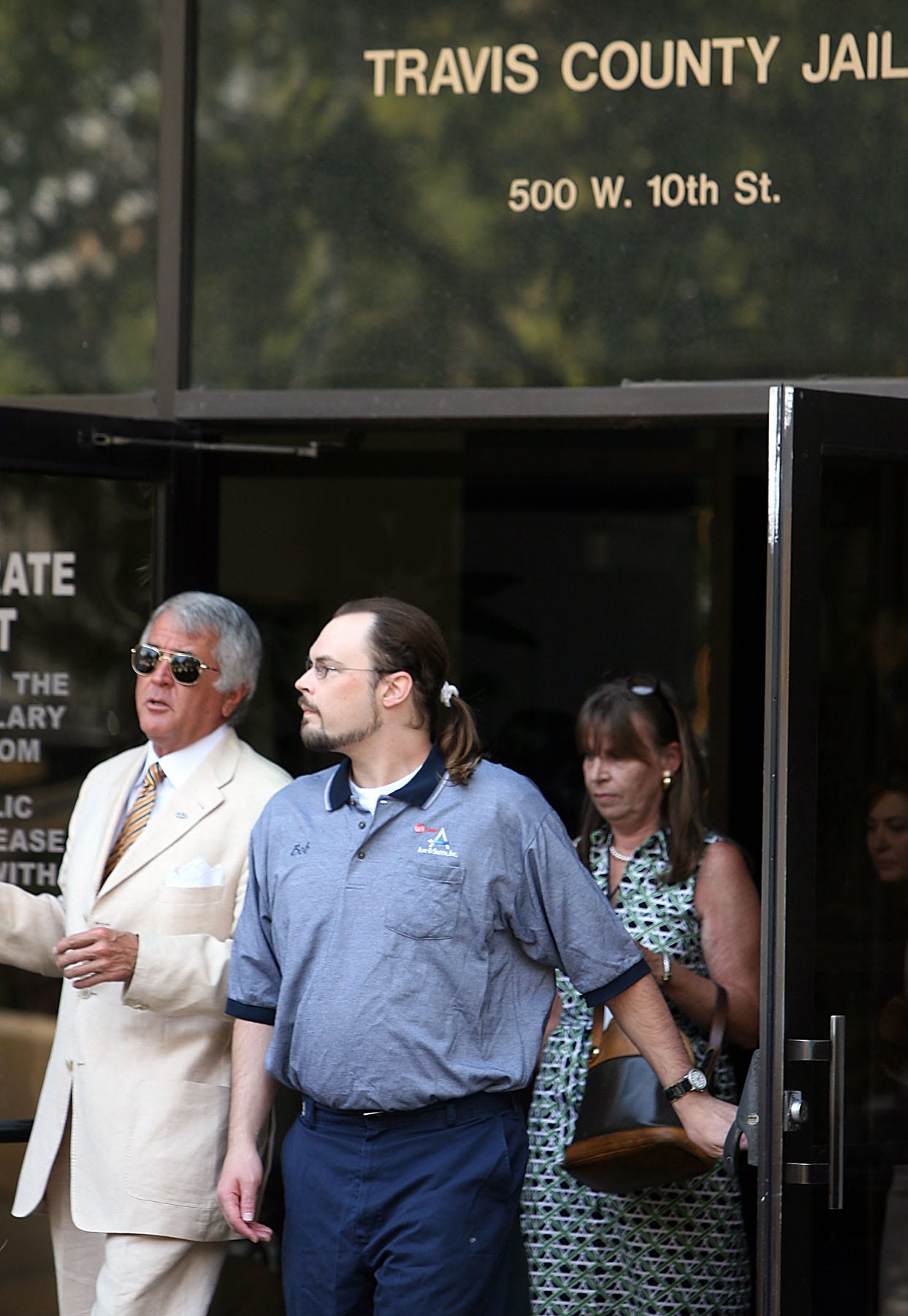 Robert Springsteen, right, walks out of the Travis County Jail with his attorney Joe James Sawyer after being released on personal bond June 24, 2009. Springsteen's conviction had been overturned three years earlier, and prosecutors struggled to rebuild the case against him.