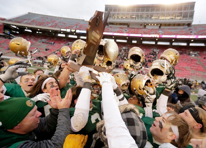Colby players celebrate their 22-7 victory over St. Mary's Springs in the WIAA Division 6 state championship football game Thursday at Camp Randall Stadium in Madison.