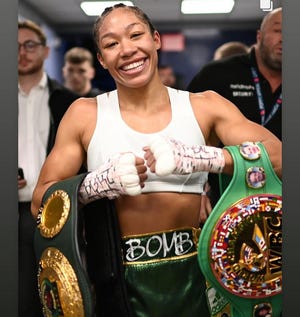 Fremont native Alycia Baumgardner, who won both the WBC and IBO boxing championship title belts, will be the grand marshal at Fremont's holiday parade.