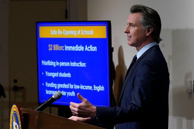 FILE - California Gov. Gavin Newsom speaks about his 2021-2022 state budget proposal during a news conference in Sacramento on Jan. 8.