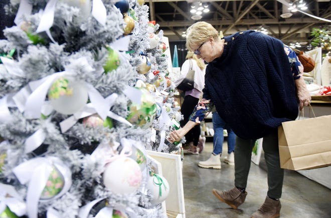 Donna Pearson looks at ornaments during the 46th Annual Les Boutiques de Noel, Shreveport Opera's major fundraiser, which starts Thursday November 18, 2021 and runs through Saturday, November 20, 2021, at the Shreveport Convention Center.
