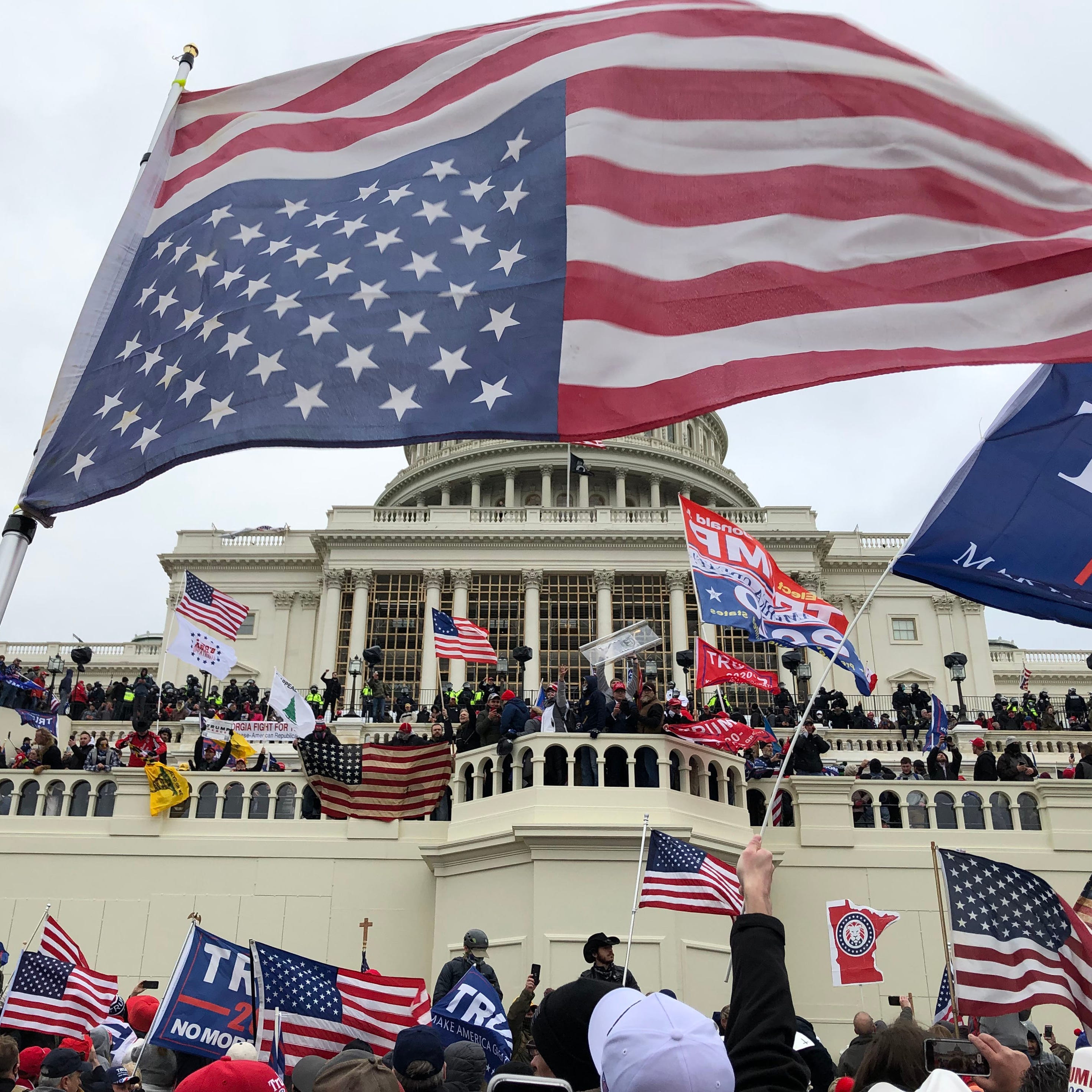 January 6, 2021: Rioters stand on the U.S. Capitol building during an insurrection to protest the official election of President-elect Joe Biden in Washington D.C.